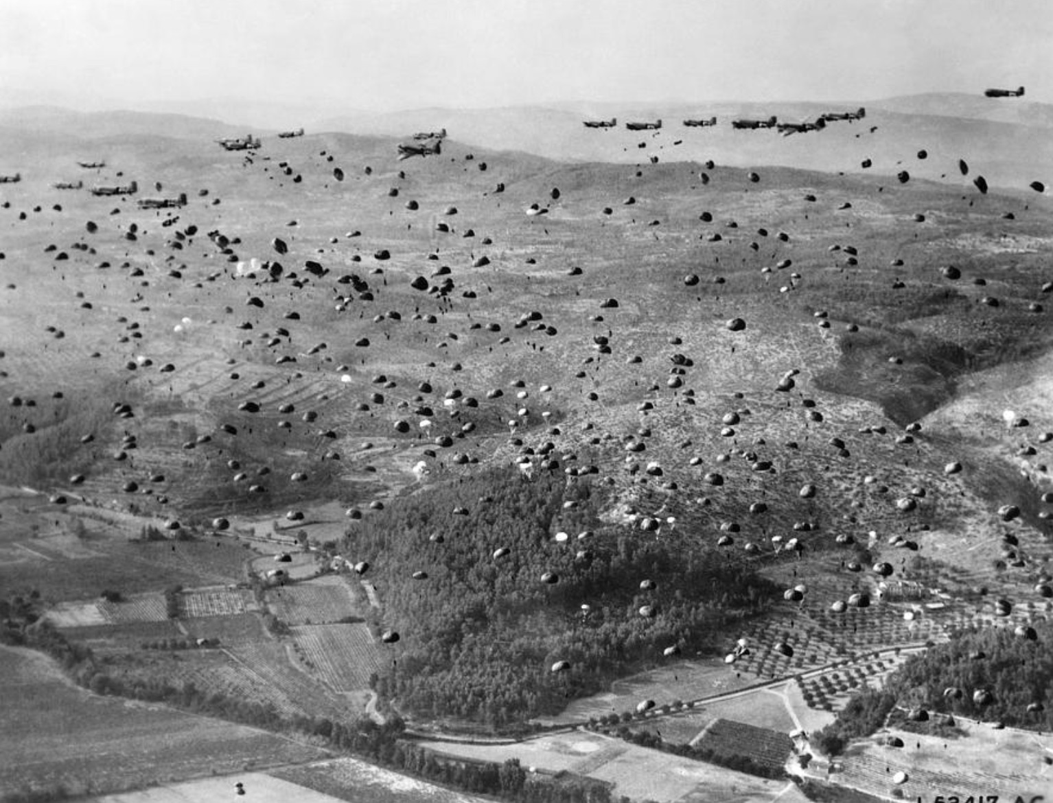 Aerial photograph of the massive force of paratroopers dropping into Normandy 